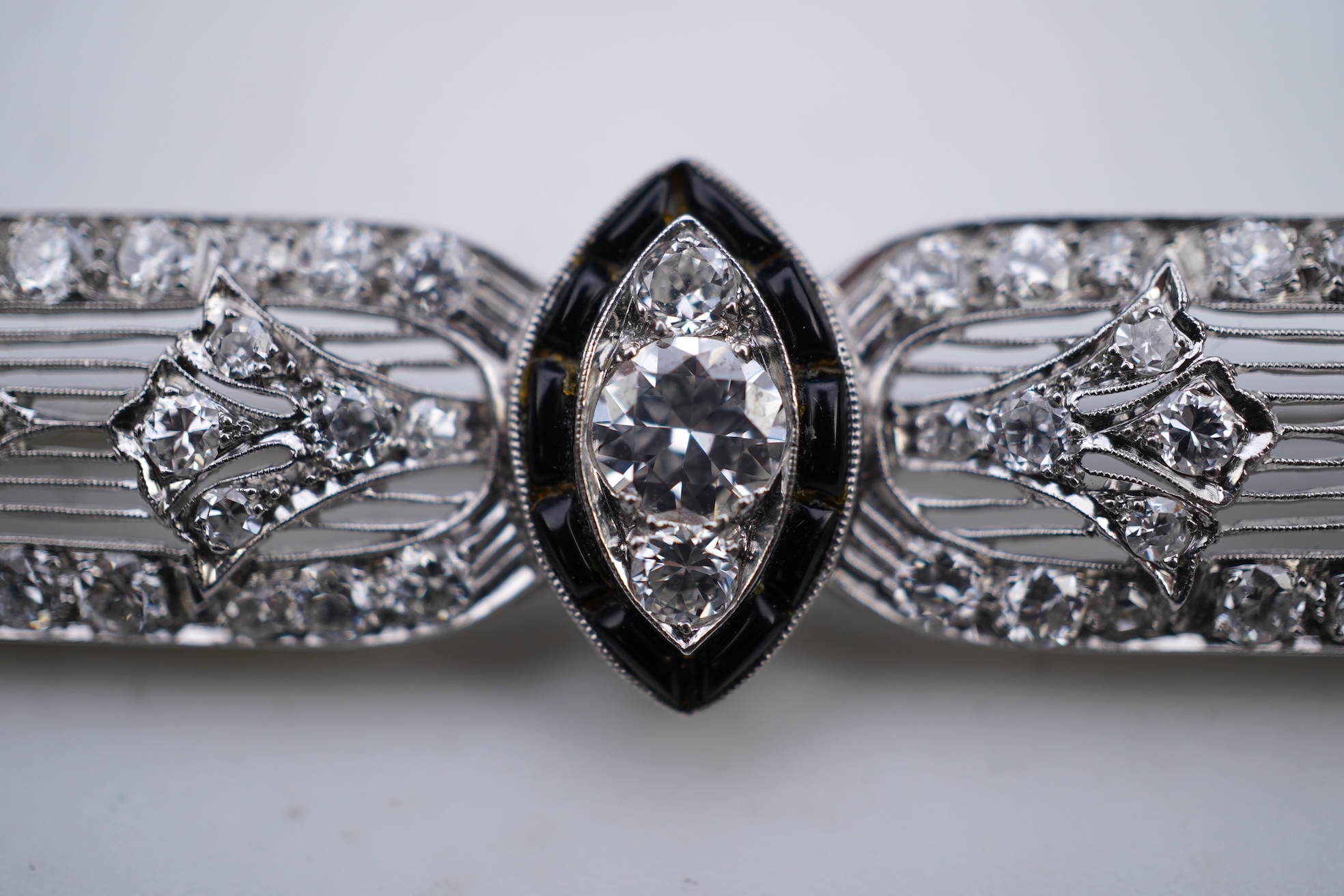 An Art Deco onyx and diamond brooch, 1920s